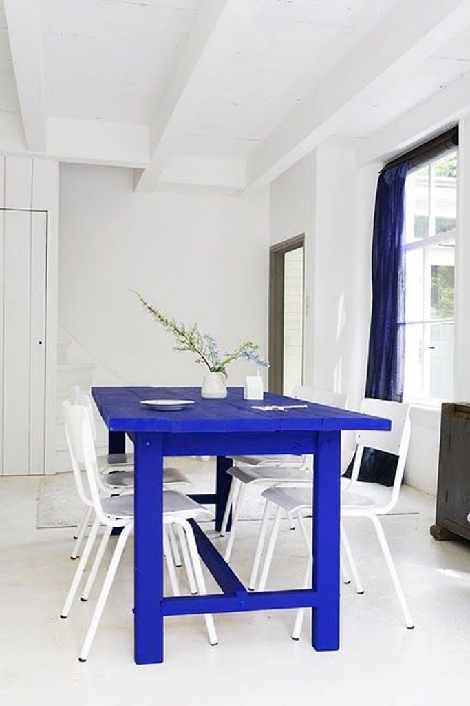 Bold Blue Farmhouse Table Anchors a Bright Dining Area