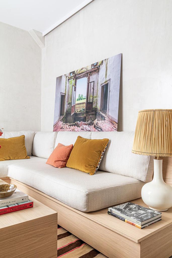 Large Artwork Adds Depth to a Minimalist Sofa Arrangement