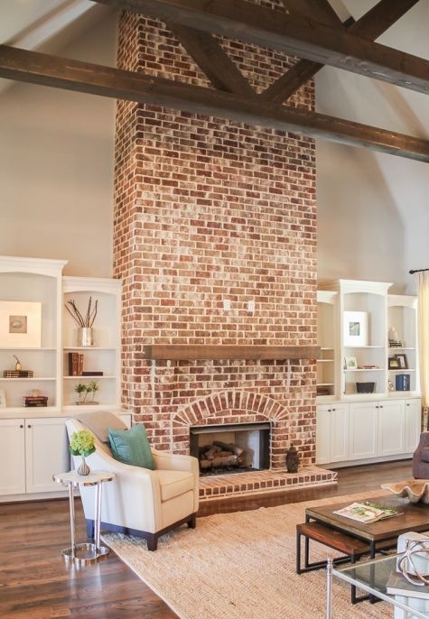 Wooden Mantel Shelf Adds a Rustic Touch to a Brick Fireplace