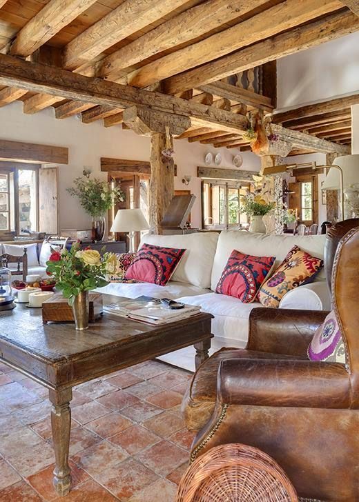 Embroidered Throw Pillows Add Patterned Accents To A White Sofa