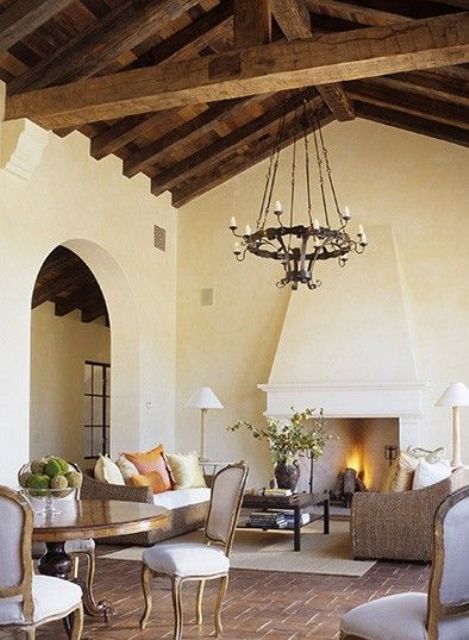 Wrought Iron Chandelier Adds Rustic Charm To A High Ceiling