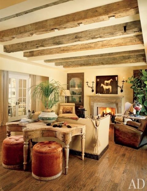 Tufted Velvet Ottomans Add Warm Color To A Rustic Desk