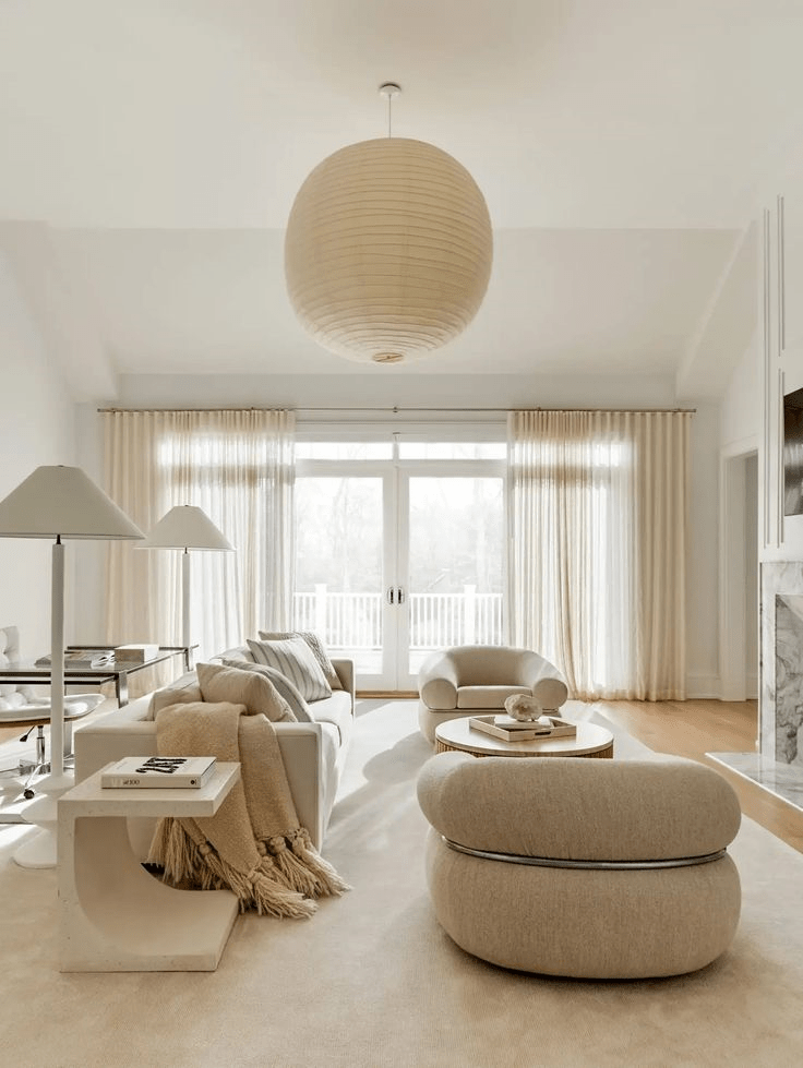 Curved Cream Ottoman Adds Softness to Seating Area
