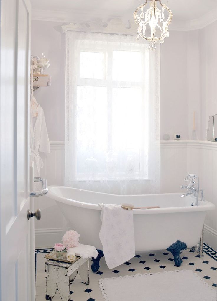 Distressed Stool Holds Pretty Bathroom Accents