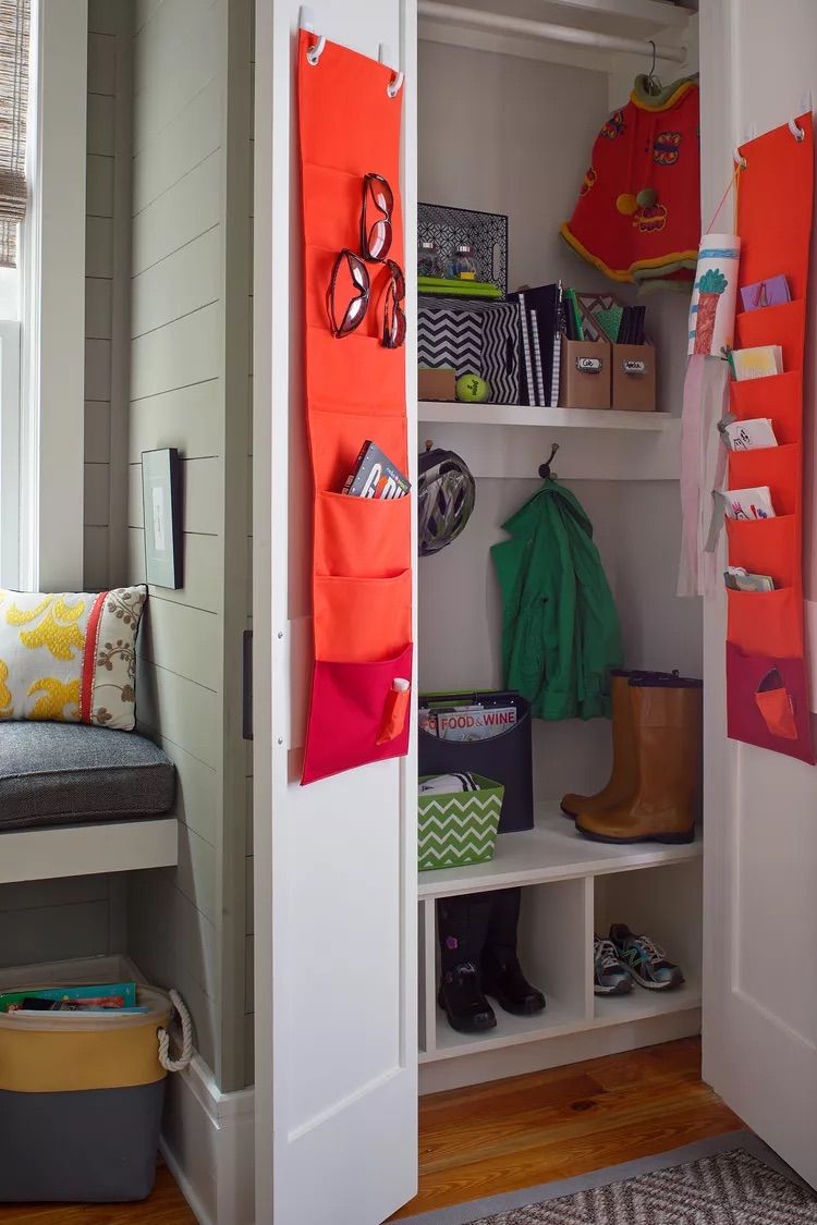 Entryway Essentials Stay Accessible in Hanging Orange Organizers