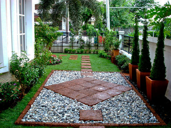 Square Stone Pavers Create a Diamond Pattern Over Gravel