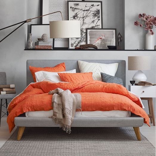 Textured Orange Duvet Adds Cozy Warmth to Grey Bed