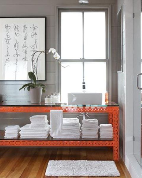 Orange Open Shelving Adds a Bold Pop to Bathroom Storage