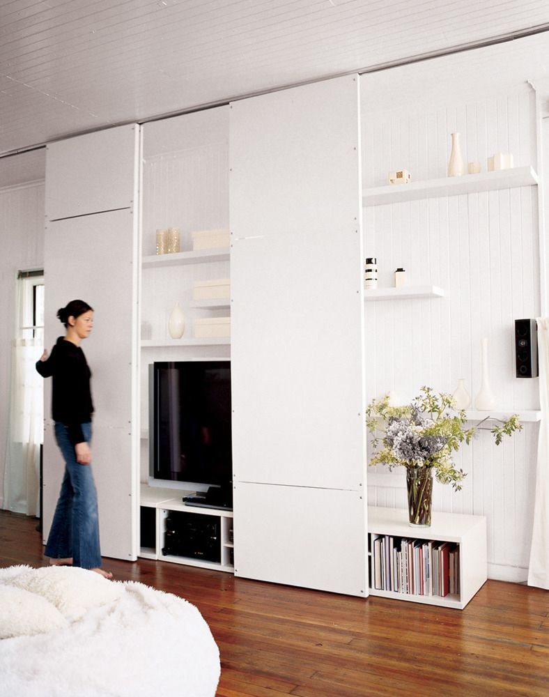 Sliding Panels Conceal Media and Shelving for a Minimalist Look