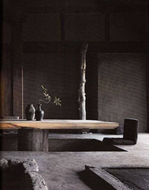 Rough-Hewn Beam Table With Minimalist Vases