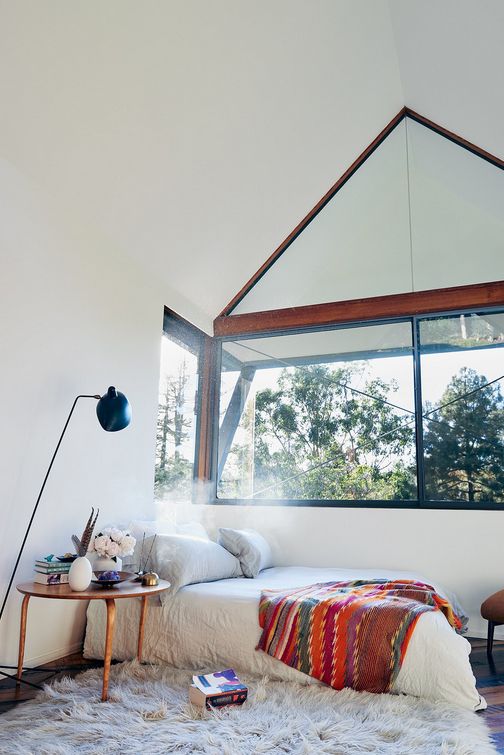 Keep Bedside Essentials on a Round Wood Side Table