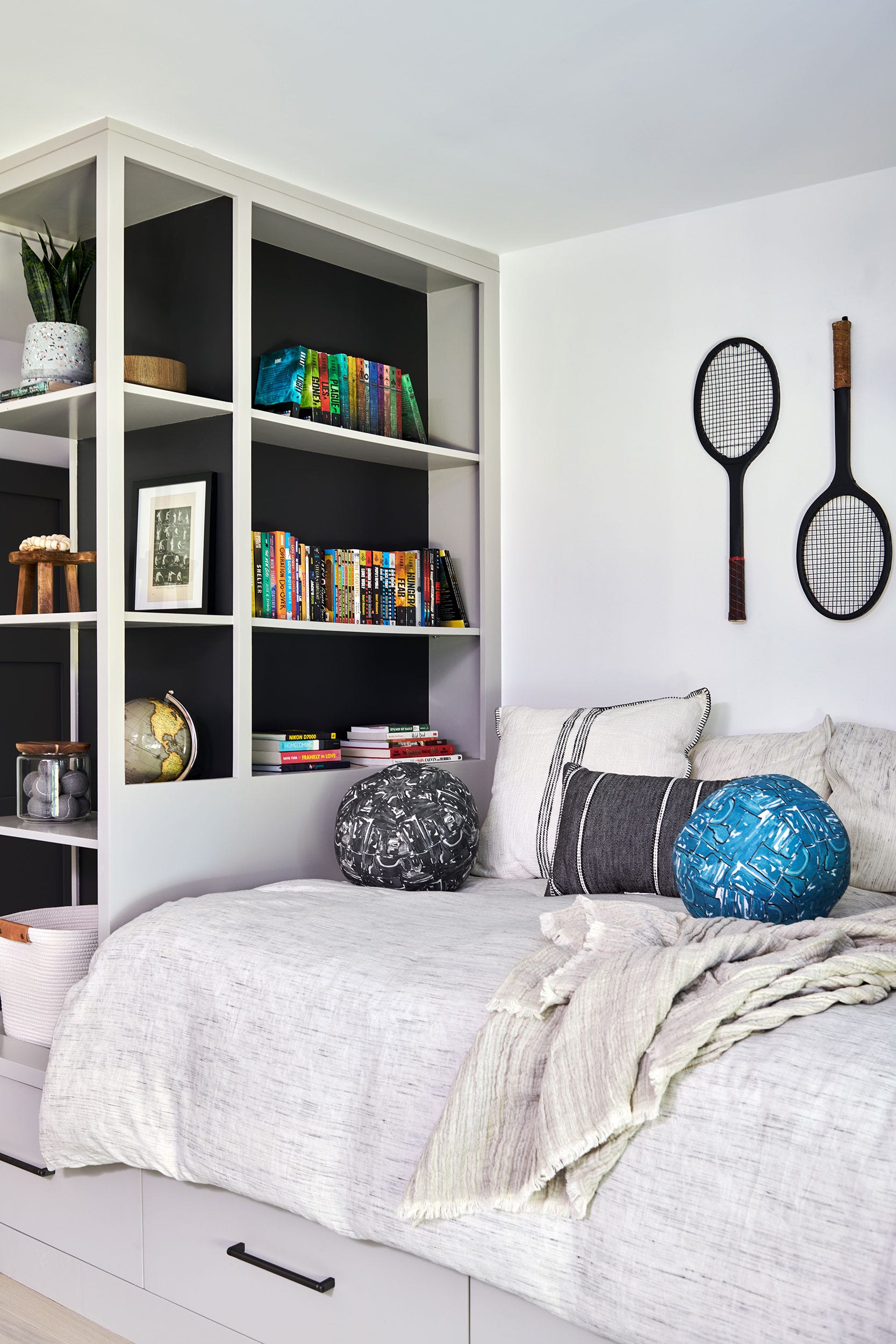 Built-in Shelving With Dark Back Panels Creates Visual Depth