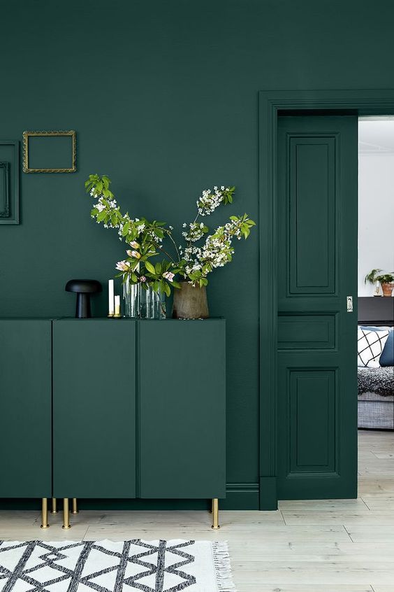 Dark Green Cabinet With Delicate Branches Adds Natural Softness