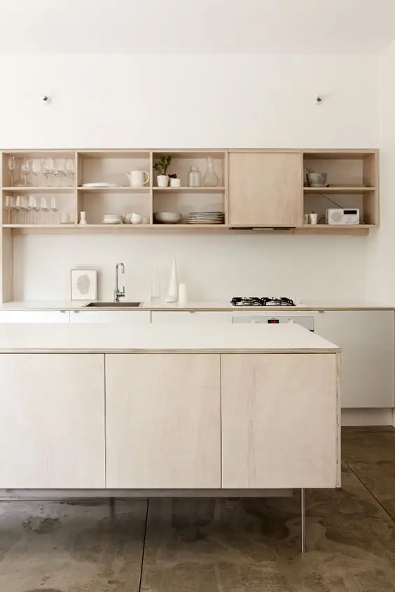 Conceal Clutter with Light Wood Cabinets Featuring a Sliding Door