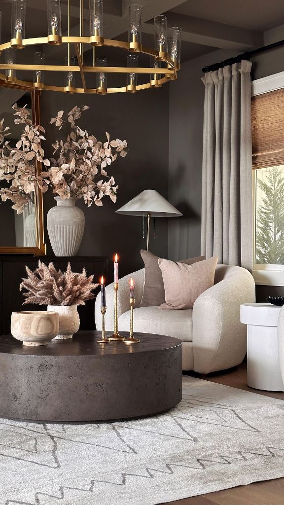 Brass Candlesticks Add Warmth To A Dark Coffee Table