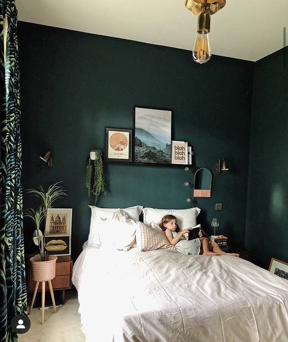Framed Art Creates A Gallery Wall Above The Bed