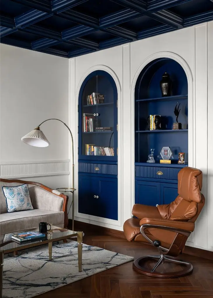 Frame Displays With Deep Blue Arched Built-Ins