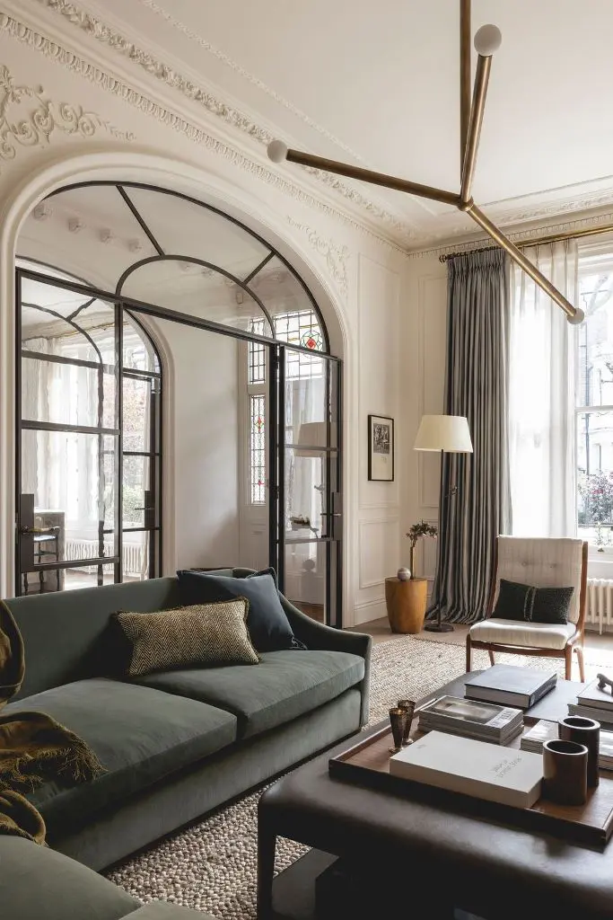 Arched Metal Doors with Stained Glass Divide Spaces