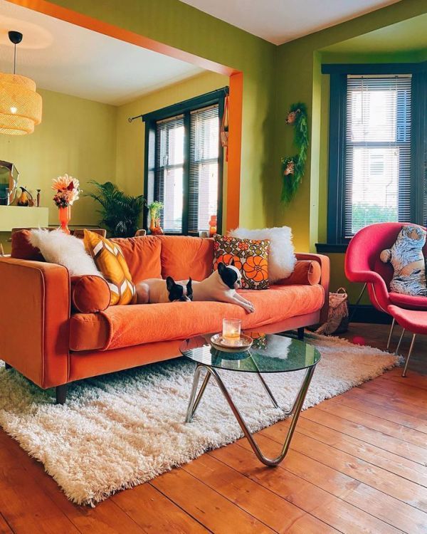 Orange Sofa With Geometric Pillows Creates A Bold Statement