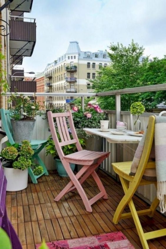 Pastel Folding Chairs Create a Playful Balcony Seating Area