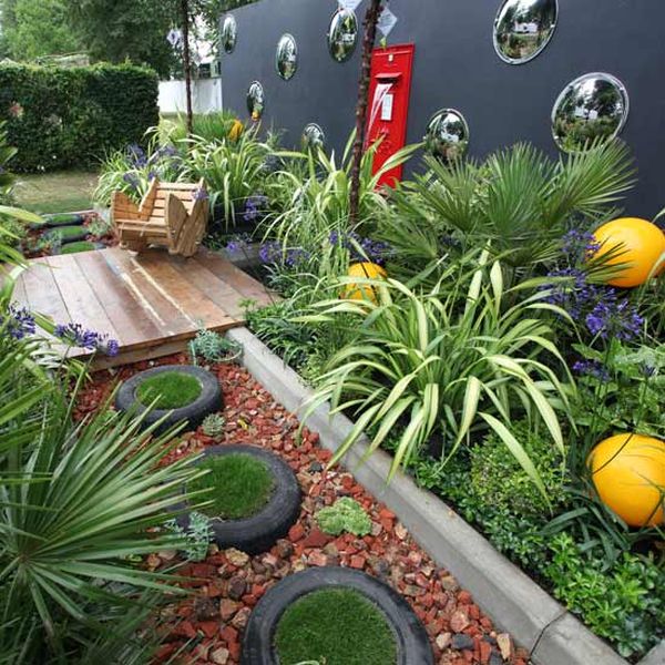 Recycled Tire Planters Add Circular Greenery to Gravel Paths