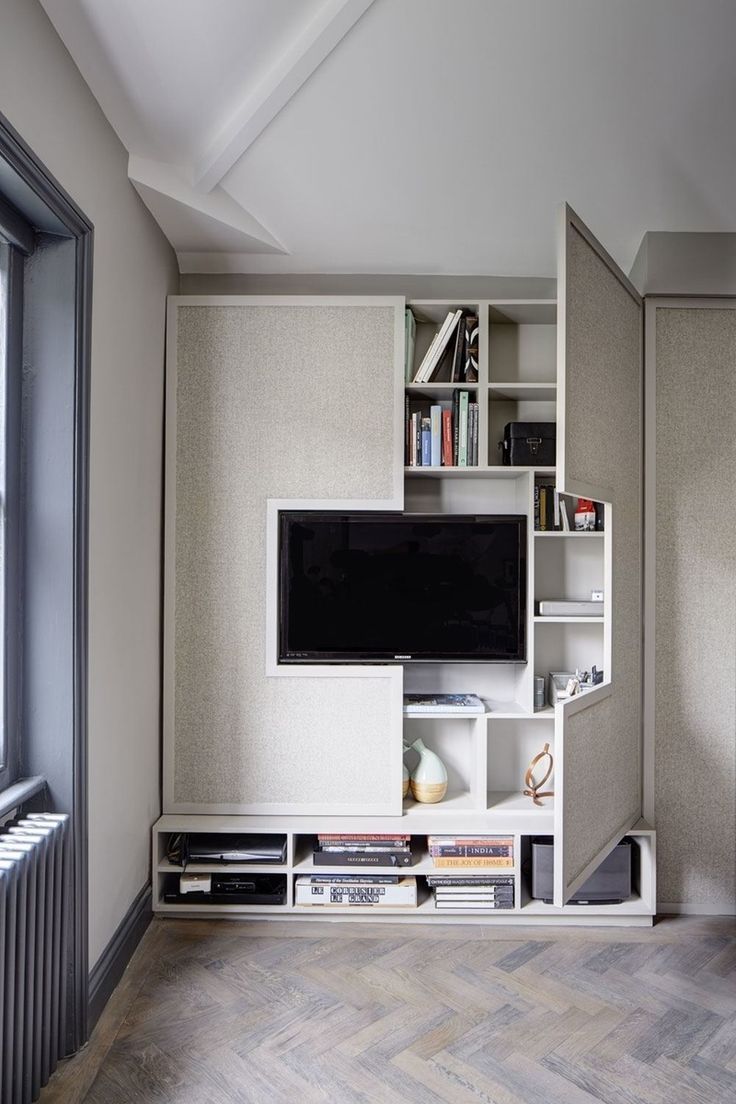 Textured Doors Conceal TV and Shelving for a Clean Look
