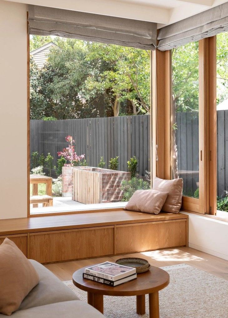 Wooden Cabinet Doors Under Window Seat Provide Discreet Storage
