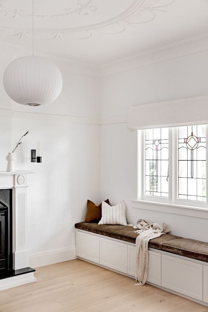 White Cabinet Doors Under Window Seat Offer Seamless Storage