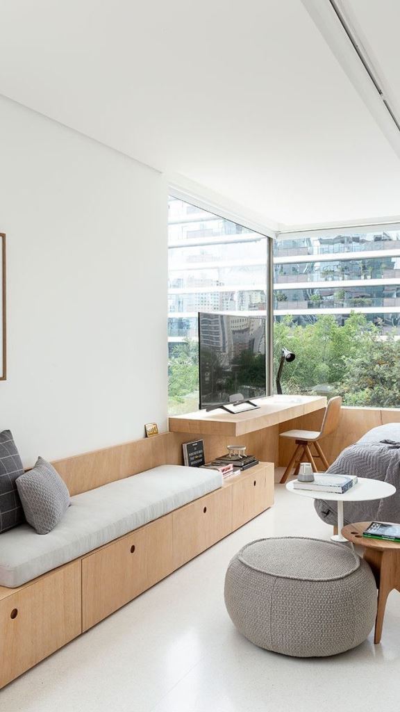Built-In Bench With Natural Wood Cabinetry Offers Clean Storage