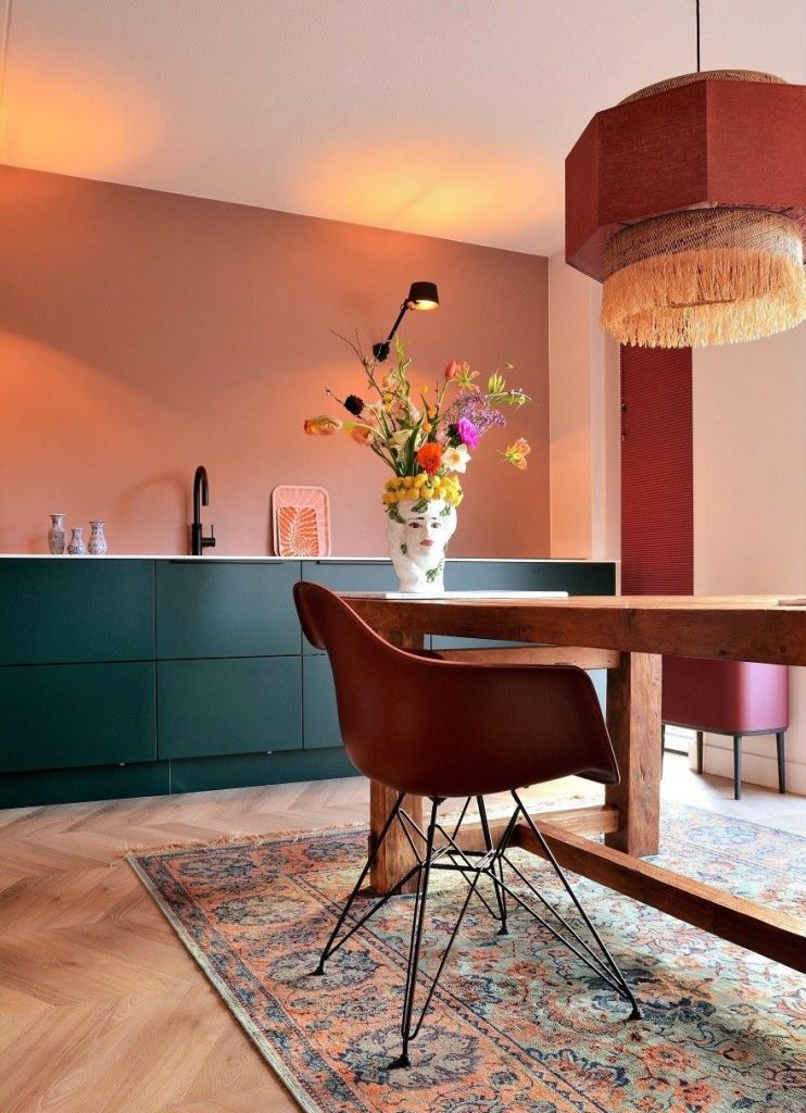 Face Vase Adds Whimsical Art to a Green Kitchen