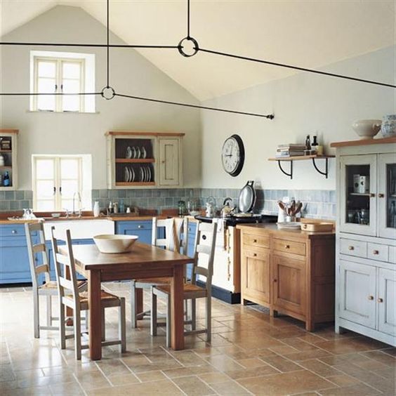 Gather Around a Wooden Dining Table with Mismatched Chairs for Casual Meals