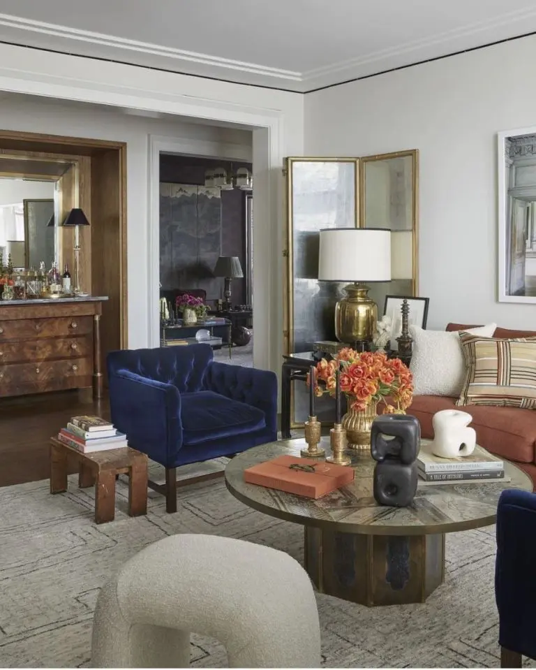 Brass Folding Screen Adds a Mirrored Accent Wall