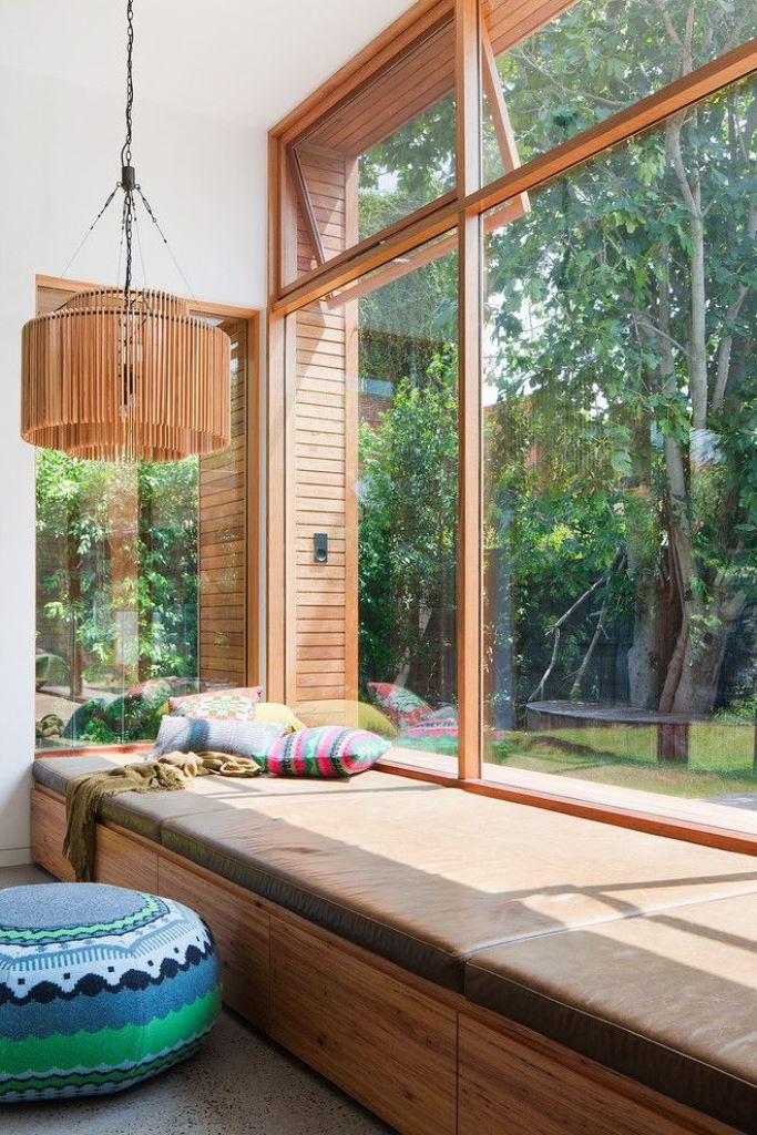Wood-Fronted Drawers Beneath Window Seat Hide Everyday Items