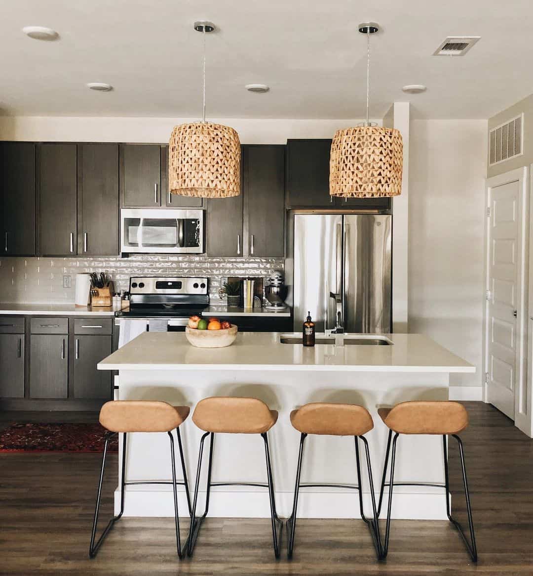 Modern Kitchen With White Countertop and Black Cabinets