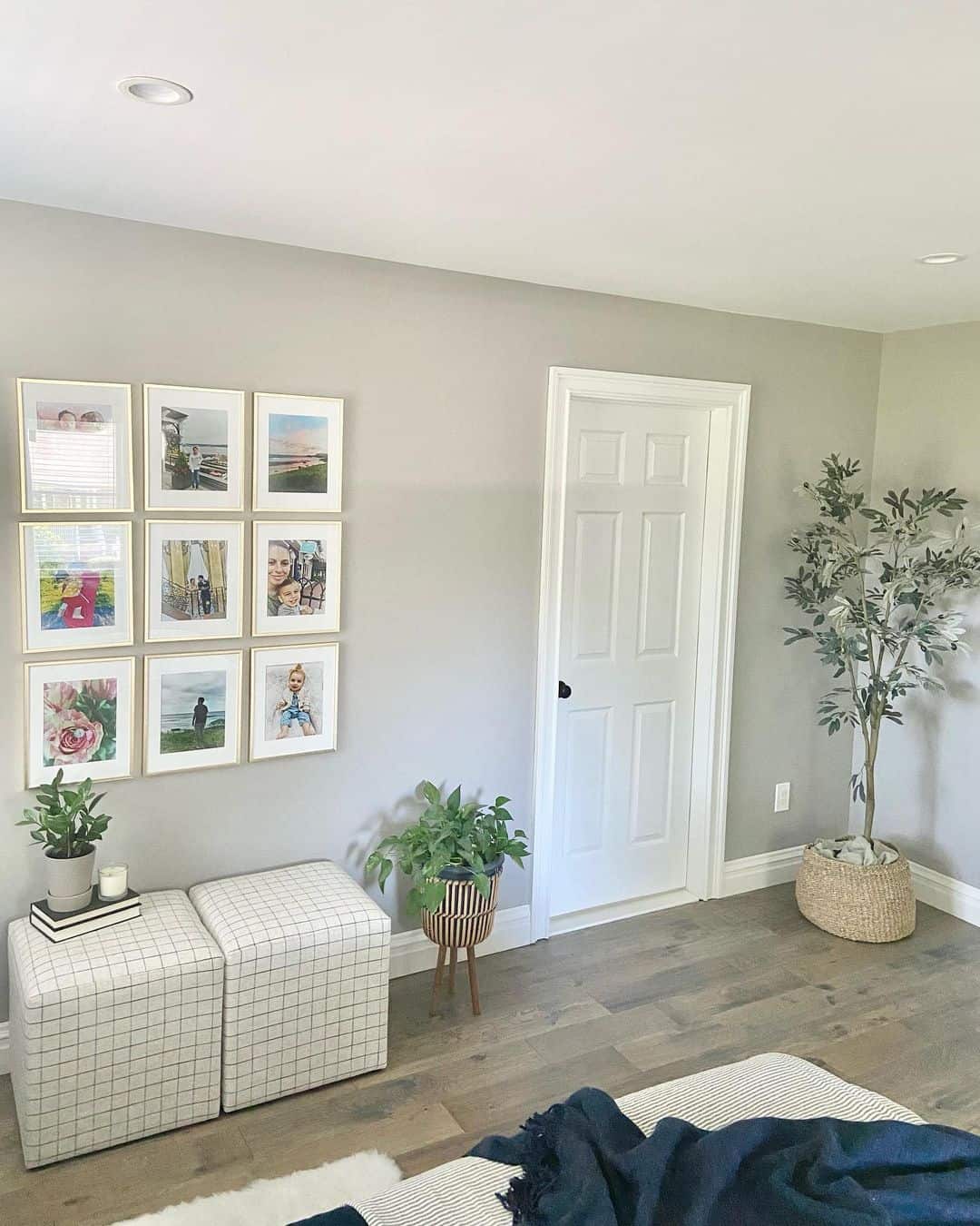 Cube Ottomans Beneath Bedroom Gallery Wall