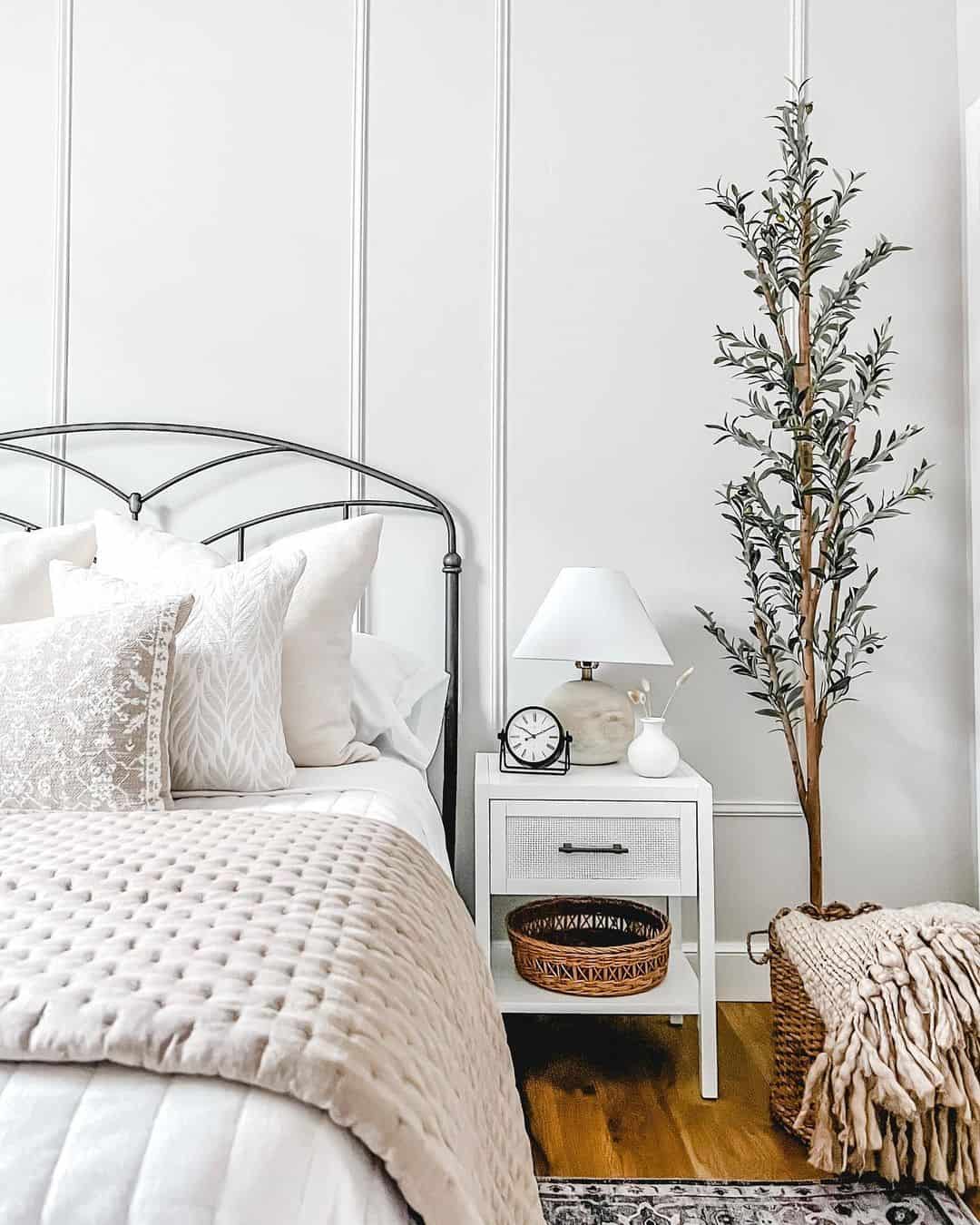 White Accent Wall and Faux Olive Tree